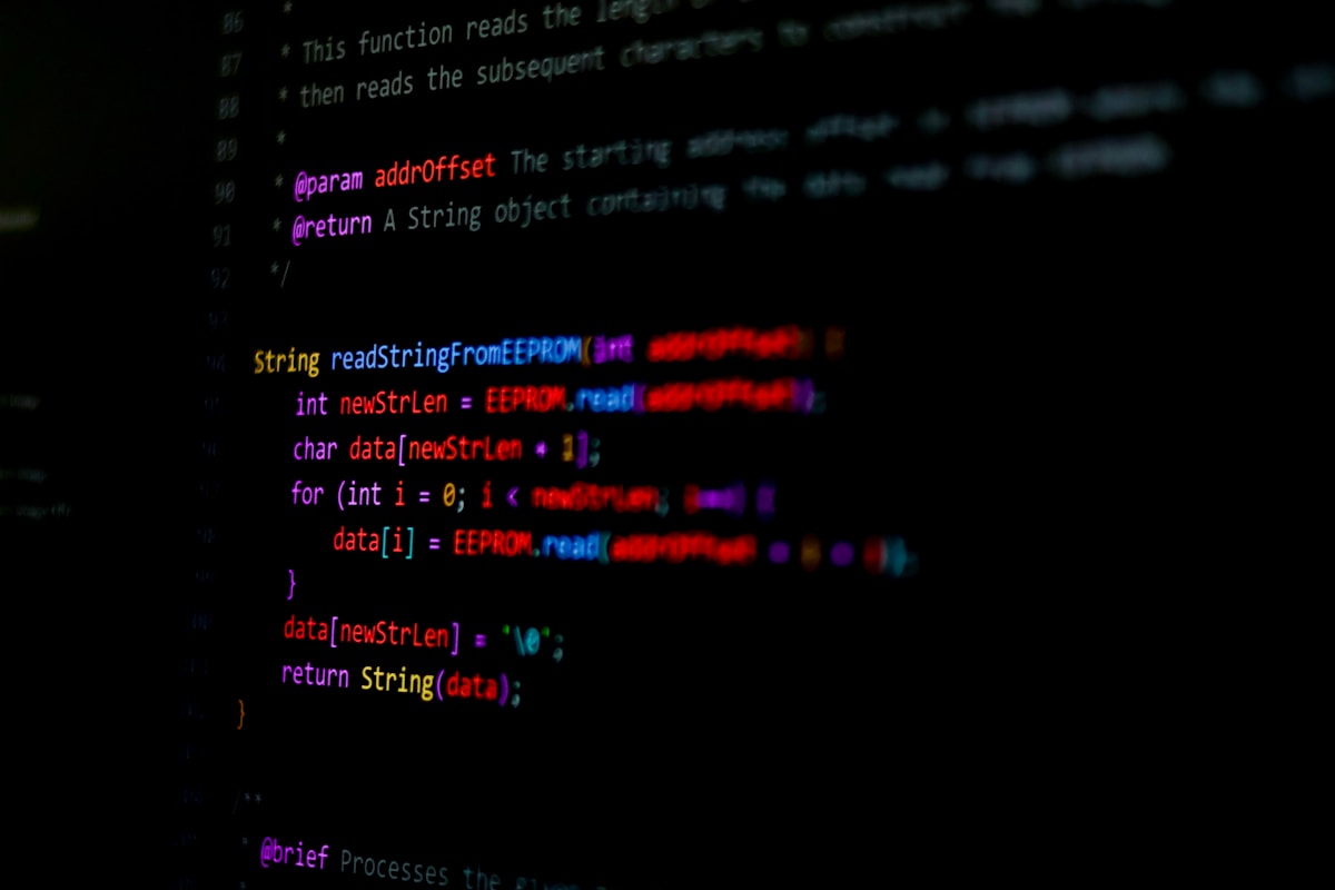 Code displayed on a dark screen showing concise script patterns