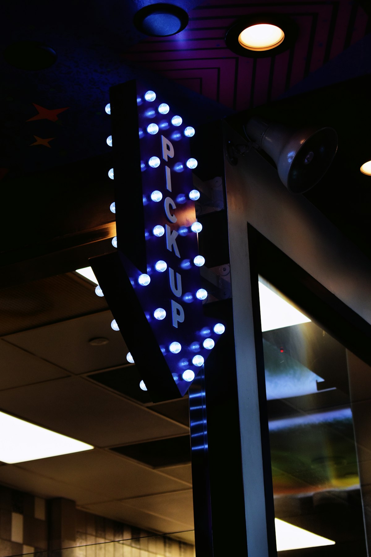 Server rack with blue lights running automated build pipelines